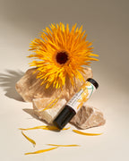 Frangipani Jasmine & Frankincense roll-on with a golden spider dahlia