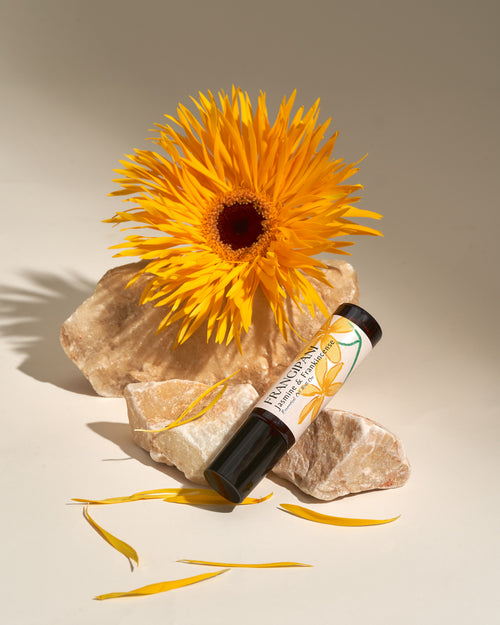 Frangipani Jasmine & Frankincense roll-on with a golden spider dahlia