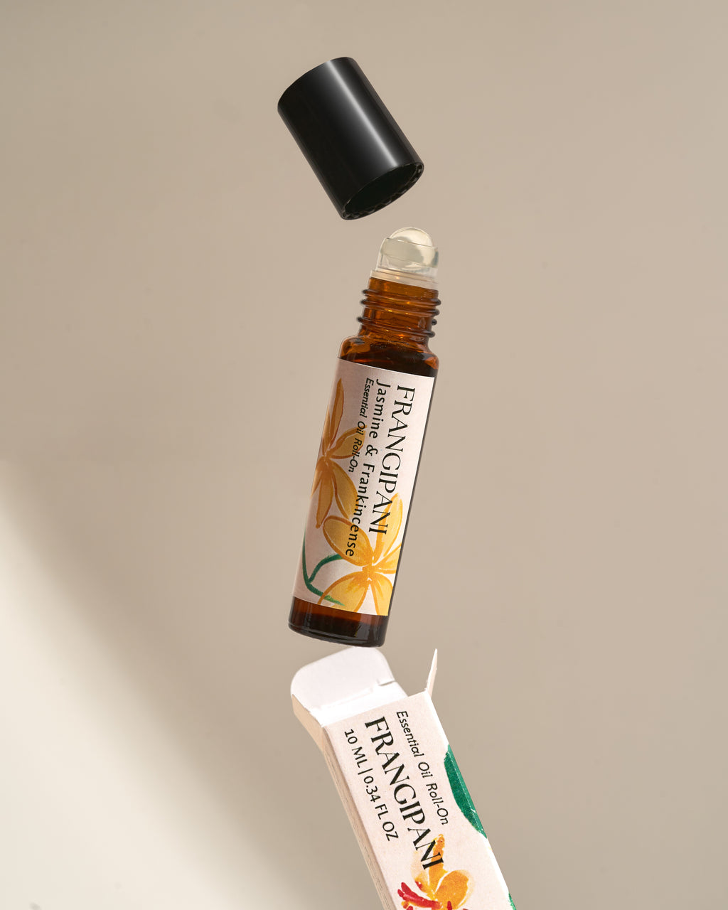 Frangipani Jasmine & Frankincense roll-on opened above its box
