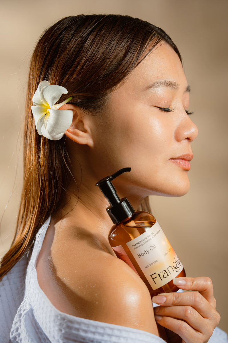 Pausing to breathe in the scent of Frangipani Body Oil